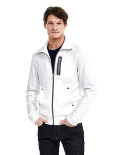 Water-Repellent Cotton Jacket White Half-zip Outerwear With Zipper Closure, Functional White Outerwear With Zipper Closure, White Half-zip Outerwear With Ribbed Cuffs, White Track Jacket With Zipper Closure For Fall, Fall Half-zip Outerwear With Side Pockets, Functional Winter Outerwear With Zipper Pocket, White Zipper Track Jacket For Winter, Waterproof Tape, Standing Collar