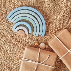 presents wrapped in brown paper and tied with twine on top of jute rug