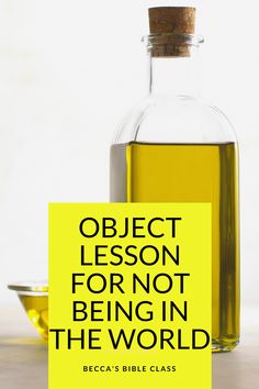 a bottle of olive oil next to a yellow sign that says object lesson for not being in the world