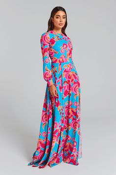 DESCRIPTION & FEATURES Jet set to the tropics and dress in SAVANNAH. A chic silhouette reinvented for an island getaway. The retro 70's floral print maxi dress features a high neck, a tight-fitting top and flowing skirt completed with two sensual thigh high splits to the front with a built-in stretch scuba brief for comfort and coverage. Finished with a waistband to enhance your physique, loose fitting sleeves and self-fastening button detailing to the cuffs. - Chiffon Crepe - Tight fitting top Rose Gold Jumpsuit, Blush Skirt, Hot Pink Pants, Nadine Merabi, Gold Jumpsuit, Rose Gold Dress, Hot Pink Tops, Dresses Spring, Hot Pink Dresses