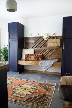 a living room filled with lots of furniture next to a wall mounted tv on top of a wooden shelf