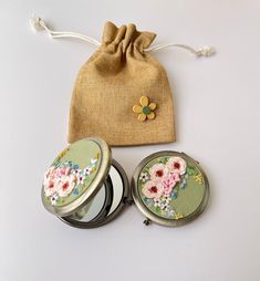 📍 Each compact mirror comes with a carrying drawstring bag. 📍  About this Embroidered mirror: The beautiful embroidered mirror is made by skilled traditional embroiders in Vietnam. The compact mirrors are easy to carry, foldable, compact and small enough to fit in your pockets and bags.  The motifs on the mirror are embroidered beautiful daisy, wild flowers, roses. These compact mirrors will be special gifts for your girl friends, mother, grandmothers, bridesmaids or wedding guests. Size: 7cm Daisy Mirror, Vintage Compact Mirror, Compact Mirror Vintage, Flower Pocket, Rose Makeup, Vintage Compact, Mirror Vintage, Bag Flower, Bachelorette Gifts