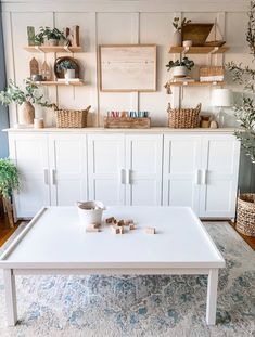 a white coffee table sitting on top of a rug