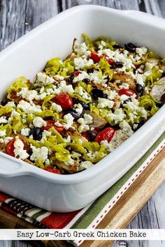 an easy low carb greek chicken bake in a white casserole dish