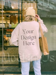 Sand Gildan 18000 trendy aesthetic mockup - this high fashion streetwear mockup is perfect for your best seller designs! One of our favorite street wear mock ups, model is wearing a beanie and oversize sweatshirt to stay trendy. - WHAT YOU GET FROM US - This product is a digital file. You'll receive a ready-to-use JPG without watermarks. - THE FINE PRINT - - You may use this photo for personal & commercial use - You may not resell this file - Image is owned by MockingUs (all rights reserved) - A Casual Winter Top With Custom Print, Trendy Branded Sweatshirt For Fall, Customizable Relaxed Fit Casual Sweatshirt, Casual Customizable Relaxed Fit Sweatshirt, Custom Print Sweatshirt For Fall Streetwear, Trendy Fall Sweatshirt With Branding, Casual Customizable T-shirt For Winter, Casual Sweatshirt With Custom Print For Streetwear, Relaxed Fit Sweater With Custom Print For Streetwear