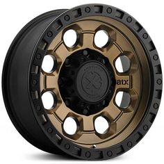 an image of a wheel that is gold and black