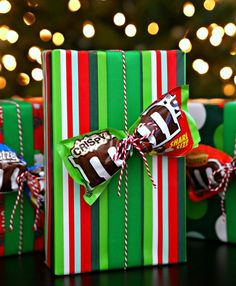 three wrapped presents sitting on top of a table