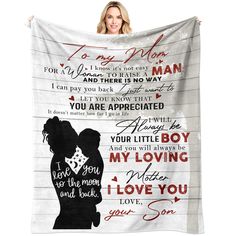 a woman holding up a blanket with the words i love you