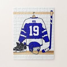 a puzzle with a hockey jersey on it and a pair of shoes next to it