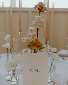 the table is set with candles and flowers