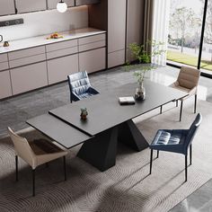 a modern dining table with four chairs around it