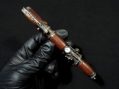 Shipping UPS delivery 6-7 days this is expedited shipping, it costs twice as much as normal. Ink pen in the style of steampunk with elements of stabilized wood.  This fountain ink pen is the best gift for an amateur steampunk style, it will become a pleasant memory of the original gift.  The patina on this pen has a "burnt" look, which gives the pen even more of an antique look. The picture of the stabilized tree is unique and unique. Stabilized wood looks like velvet, looks very nice and is pleasant to the touch. On the pen there is an imitation of a pressure gauge The pen is designed for the use of a reusable convector that comes in the kit. Materials: brass, copper, stabilized wood Regards, Igor The actual appearance of the product (handmade) may differ slightly from photo. Luxury Birthday Gifts, Steampunk Pendant, Stabilized Wood, Steampunk Goggles, Luxury Birthday, Illustration Pen And Ink, Wooden Pen, Steampunk Accessories, Steampunk Style