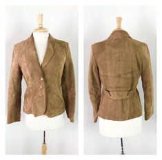 "Vintage 1970s Brown Suede Leather Jacket - Made in Mexico. Fully lined. Pockets. Back martingale for nipped waist and a little swing. Labeled Sz 11/12: 18\" bust laying flat. 15.5\" waist laying flat. 14\" shoulder-to-shoulder. 23\" in length. Excellent condition: some darker lines from wear on back (see photos), but adds to the charm." Vintage Leather Fitted Blazer, Vintage Fitted Leather Jacket For Formal Occasions, Vintage Formal Fitted Leather Jacket, Vintage Leather Jacket For Spring Workwear, Spring Vintage Leather Jacket For Office Wear, Fitted Retro Leather Jacket For Workwear, Vintage Fitted Leather Jacket For Work, Brown Suede Leather Jacket, Suede Leather Jacket