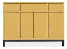 a yellow cabinet with three doors and two drawers on one side, in front of a white background