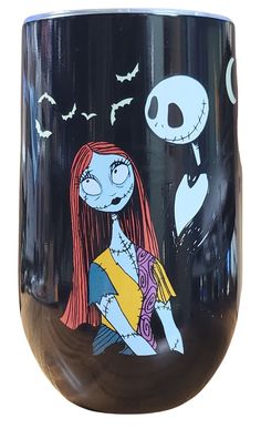 a glass with a cartoon character painted on the side and an image of a skeleton