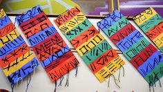 colorful pieces of paper with writing on them