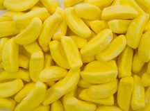 yellow candy corn kernels sitting on top of each other