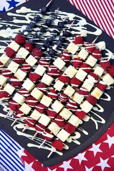 an american flag platter with strawberries and cheese