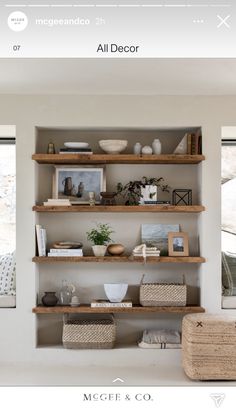 the shelves in this room are filled with books and other items, including vases