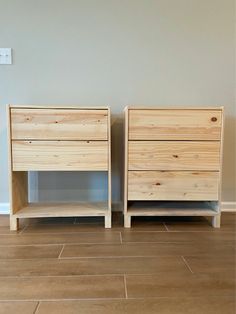 two wooden nightstands sitting next to each other on top of a hard wood floor