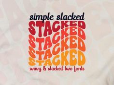 a white t - shirt with the words stacked and stacked in orange, red, and yellow