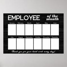 a black and white employee sign hanging on a wall