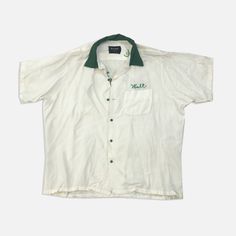 Vintage bowling button up Green and white "Walt" 1950s-1960s Size: Large Measurements: armpit to armpit: 25” top of neck to bottom: 28” Vintage White Shirt With Button Closure, Retro White Buttoned Tops, Retro White Collared Top, Retro White Tops With Buttons, White Retro Collared Top, White Collared Retro Top, White Retro Shirt With Buttons, Retro White Shirt With Buttons, Vintage Bowling