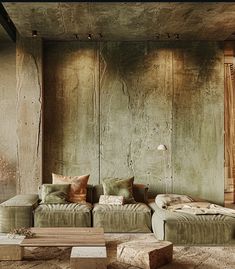 a living room with two couches and a coffee table in front of a wooden wall