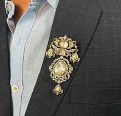 Brooches for both women and men. Opt for Victorian-inspired designs or intricate Polki, Kundan, and Moissanite options for a statement look. Vintage jewelry adds timeless elegance, while a Jadau or diamond brooch pin enhances sophistication. Perfect for weddings or any special occasion, these pieces make a standout statement. *𝐏𝐑𝐎𝐃𝐔𝐂𝐓 𝐃𝐄𝐓𝐀𝐈𝐋* * Material: Brass * Plating: Gold & Dual Tone Plated * Stones: Polki Kundan, Diamond *𝐃𝐈𝐒𝐂𝐋𝐀𝐈𝐌𝐄𝐑* Product color may slightly vary due to photographic lighting sources or your screen settings. *𝐅𝐎𝐑 𝐌𝐎𝐑𝐄 𝐄𝐗𝐂𝐋𝐔𝐒𝐈𝐕𝐄 𝐂𝐎𝐋𝐋𝐄𝐂𝐓𝐈𝐎𝐍 𝐕𝐈𝐒𝐈𝐓 𝐔𝐒* https://www.etsy.com/shop/AgulkaJewels Brooch Design For Men, Traditional Silver Brooches For Formal Occasions, Traditional Formal Brooch With Intricate Design, Luxury Wedding Brooch, Luxury Brooch Pins For Wedding, Classic Wedding Brooches With Intricate Design, Gold Brooches With Intricate Design For Wedding, Silver Brooch Pins For Wedding, Luxury Wedding Brooch Pins