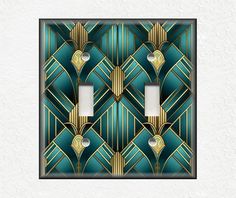 an art deco light switch plate cover in teal and gold