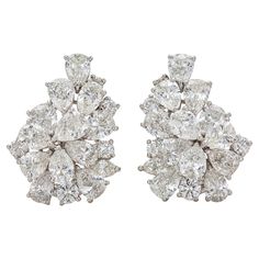 Finely crafted in platinum with Pear-Shaped, Round and Marquise cut Diamonds weighing a total of 14.28 carats, G-H color, VS1-VS2 clarity. Circa 1950s 1 inch length Luxury Diamond-shaped Diamond Earrings, Luxury Vintage Rose Cut Diamond Earrings, Autumn 2024, Marquise Cut Diamond, Pear Shaped Diamond, Gorgeous Jewelry, Marquise Cut, Dream Jewelry, Birthstone Jewelry