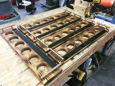 a wooden table with many holes in it