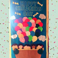 an image of children's day bulletin board with balloons