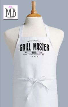 a white apron with the words grill master on it and a bow at the waist