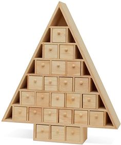 a wooden toy pyramid with drawers in it