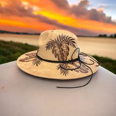 Monstera Deleciosa in Camel Such a pretty neutral. Burned Wide brim Hat using Pyrography techniques. Each Hat is a One of a Kind as all Hats are burned freehand. Hats are sealed with a weather proofer. Hats are all adjustable for a tighter fit. All hats made by PIPER, come with a PIPER Signature Hat dust/travel bag and a macrame wall hanger. Vacation Wide Brim Felt Hat, Adjustable Curved Brim Felt Hat For Vacation, Flat Brim Felt Hat For Vacation, Wide Brim Felt Hat For Vacation, Adjustable Felt Hat With Curved Brim For Vacation, Brimmed Felt Hat For Beach, One Size, Brimmed Felt Hat For The Beach, Beach Felt Hat With Wide Brim, Bohemian Curved Brim Hat For Travel