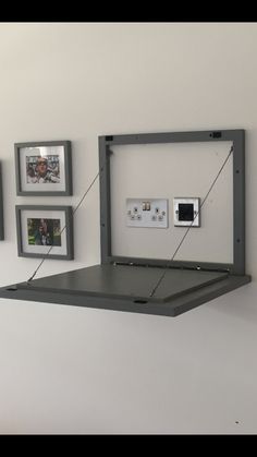 an electrical outlet is attached to the wall with wires and pictures on it's sides