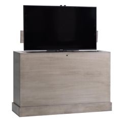 a flat screen tv sitting on top of a wooden cabinet