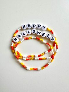 Get into the Halloween spirit with this bewitching trio of charm bracelets, perfect for adding a touch of festive flair to your October! Celebrate the season with this candy corn color bracelet combo that captures the essence of Halloween magic!  Details: 👻 Sizing: 6in, 6-1/2 in, 7in, 7 1/2in 🎃 Over stretching or pulling of bracelet will cause breakage.  🌙 All order typically ship between 1-3 business days. Make sure your address is correct before purchasing! If you have any questions please dont hesitate and message me! :) Halloween Gift Bracelets With Letter Beads, Halloween Beaded Bracelets With Letter Beads, Halloween Bracelets With Letter Beads And Round Shape, Halloween Letter Beads Bracelet With Round Beads, Halloween Jewelry With Round Letter Beads, Halloween Beaded Bracelet, Halloween Bracelet Ideas, Bracelets Fall, Fall Bracelets