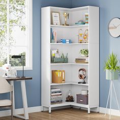 a room with blue walls and a white bookcase in the corner next to a desk