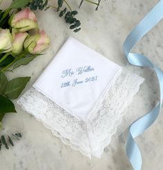 "Give a truly unique gift with our luxury lace wedding handkerchief. Made from the highest quality materials, each handkerchief can be custom embroidered with a date, monogram of the couple's initials or your own special message.  Each handkerchief comes gift wrapped in its own individual ribbon-tied box. For longer messages requiring more characters, please see our custom embroidered message handkerchiefs https://www.etsy.com/uk/listing/877263122/wedding-handkerchief-from-bride-message?ref=shop_home_active_10&frs=1&crt=1 * Embroidery colours pictured ;  \"Mrs Walker\" - Powder Blue \"LMS\" - Powder Blue \"Sophia&Daniel\" - Gold How to Order; - Select thread colour for embroidery. - Add the lettering for personalisation. If you would like a design proof before ordering, please contact us Elegant Lace Work Handkerchief For Wedding, Lace Wedding Handkerchiefs With Lace Work, Wedding Handkerchiefs With Lace Work, Elegant Wedding Handkerchief With Lace Work, Lace Handkerchiefs With Lace Trim For Wedding, Elegant Lace Wedding Handkerchief, Elegant Lace Work Handkerchiefs Gift, Wedding Lace Handkerchief With Lace Work, Elegant Lace Work Wedding Handkerchief