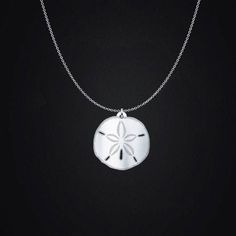 This sterling silver sand dollar necklace is a beautiful reminder of the ocean waves and summer days at the beach all year long.  General Information: It has an incredible shine that you will love every time that you look at it. Charm comes in four sizes: - 3/4in (20mm) - 1in (24mm) - 1.18in (30mm - 1.5in (38mm) Chains come in two lengths: - 18in (45cm) - 20in (50cm) Charms are a sturdy and thick .036in (0.9mm), 20 gauge sterling silver. Chains are a .047in 45.00(1.2mm) thickness Italian sterlin Sterling Silver Pendant Jewelry For Beach, Starfish Charm Strand Jewelry For Beach Season, Starfish Charm Necklace For Beach Season Gift, Sterling Silver Ocean-inspired Necklaces, Starfish Necklace For Beach Season Gift, Beach Season Starfish Charm Strand Jewelry, Ocean-inspired Strand Charm Necklaces As Gift, Ocean-inspired Strand Jewelry With Starfish Charm, Ocean-inspired Sterling Silver Necklaces