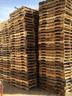 several stacks of wooden pallets stacked on top of each other