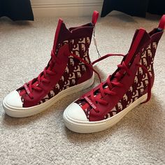 Brand New Never Worn Red Dior Sneakers! Love Them But About Half A Size Too Small On Me. Luxury Red High-top Sneakers, Designer Red High-top Sneakers With Red Sole, Designer Red High-top Sneakers With Round Toe, Designer Red Lace-up High-top Sneakers, Designer Red Lace-up Sneakers, Christian Dior Sneakers, Red High Tops, Dior Star, Dior Sneakers