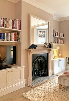 a living room filled with furniture and a fire place