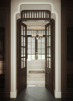 an open door leading to a bathroom with a chandelier