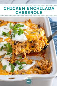 chicken enchilada casserole in a white baking dish