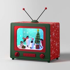 an old fashioned television with christmas decorations on it