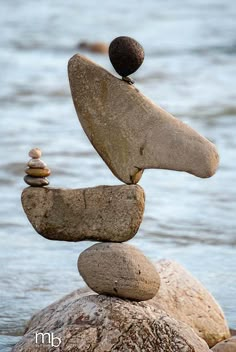 rocks stacked on top of each other in the water