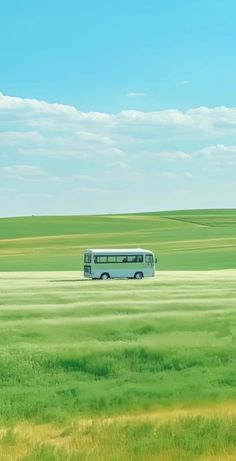 a bus is driving through an open field